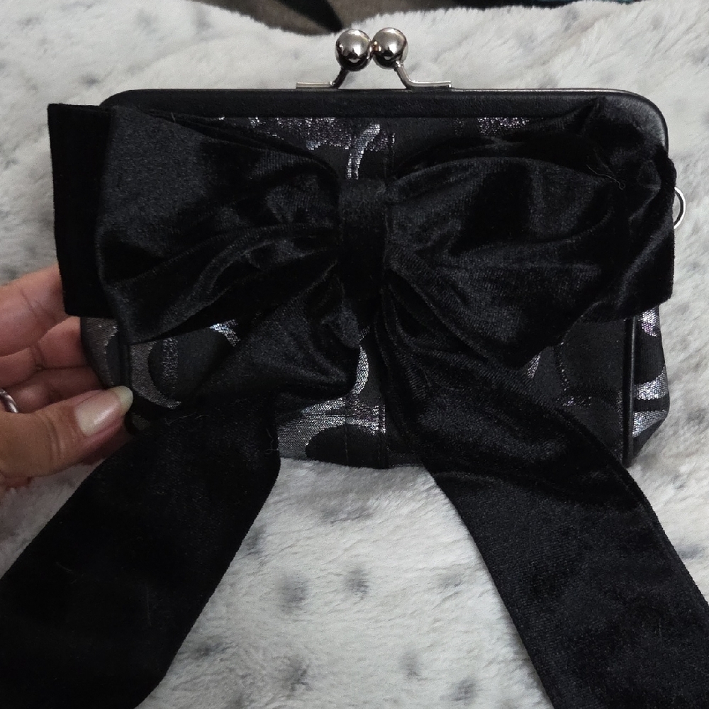 Elegant Black  Coach Clutch with Bow Accent